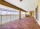 Brick paved balcony overlooking a lake with a covered section at 880 Spinnaker Way, Kissimmee, FL 34746