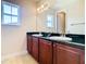 Double vanity bathroom with granite countertop at 880 Spinnaker Way, Kissimmee, FL 34746