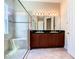 Spa-like bathroom featuring a walk-in shower and double vanity at 880 Spinnaker Way, Kissimmee, FL 34746