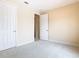 Spacious bedroom with two closets and neutral walls at 880 Spinnaker Way, Kissimmee, FL 34746