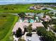 Aerial view of community pool, clubhouse, and lush landscaping at 880 Spinnaker Way, Kissimmee, FL 34746