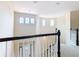 Upper level hallway overlooks the home's entryway at 880 Spinnaker Way, Kissimmee, FL 34746
