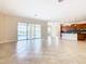 Open kitchen with island, stainless steel appliances, and dark wood cabinets at 880 Spinnaker Way, Kissimmee, FL 34746
