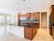 Island kitchen with granite countertops and pendant lighting at 880 Spinnaker Way, Kissimmee, FL 34746