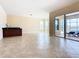 Living area with wet bar and access to pool area at 880 Spinnaker Way, Kissimmee, FL 34746