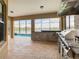 Outdoor kitchen with built-in grill and amazing lake view at 880 Spinnaker Way, Kissimmee, FL 34746