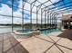 Enclosed pool and spa with a lake view at 880 Spinnaker Way, Kissimmee, FL 34746