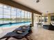 Relaxing poolside patio with lake view at 880 Spinnaker Way, Kissimmee, FL 34746