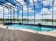 Enclosed pool and spa with stunning lake views at 880 Spinnaker Way, Kissimmee, FL 34746