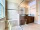 Spacious shower with bench and glass enclosure in the bathroom at 880 Spinnaker Way, Kissimmee, FL 34746