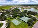 Aerial view of tennis and basketball courts in a community at 880 Spinnaker Way, Kissimmee, FL 34746