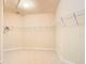 Large walk-in closet with wire shelving and carpeted floor at 880 Spinnaker Way, Kissimmee, FL 34746