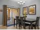 Charming dining area with a table, chairs, and access to a patio at 8963 Coco Palm Rd, Kissimmee, FL 34747
