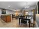 Open concept living and dining area with a kitchen island and seating at 8963 Coco Palm Rd, Kissimmee, FL 34747