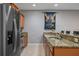 Sleek kitchen with stainless steel appliances and granite countertops at 8963 Coco Palm Rd, Kissimmee, FL 34747
