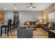 Comfortable living room featuring gray sofas, a coffee table and a large TV at 8963 Coco Palm Rd, Kissimmee, FL 34747
