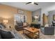 Cozy living room with comfortable seating and large windows at 8963 Coco Palm Rd, Kissimmee, FL 34747