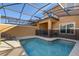 Private screened pool with patio and lounge chairs at 8963 Coco Palm Rd, Kissimmee, FL 34747