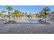 Large resort-style pool with waterfall feature and lounge chairs at 8963 Coco Palm Rd, Kissimmee, FL 34747