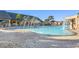 Stunning resort pool with waterspouts and surrounding patio at 8963 Coco Palm Rd, Kissimmee, FL 34747