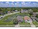 Aerial view of a house community with pond and lush green landscape at 102 Circle Hill Rd, Sanford, FL 32773