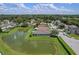 Aerial view showcasing a house near a pond and lush green surroundings at 102 Circle Hill Rd, Sanford, FL 32773