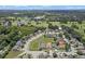 Aerial view of neighborhood with pond and lush trees at 102 Circle Hill Rd, Sanford, FL 32773