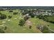 Aerial view of golf course with homes and pond at 102 Circle Hill Rd, Sanford, FL 32773