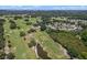 Aerial view of golf course with homes and pond at 102 Circle Hill Rd, Sanford, FL 32773
