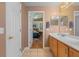 Bathroom with double vanity, access to bedroom and tub at 102 Circle Hill Rd, Sanford, FL 32773