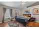 Relaxing bedroom with hardwood floors, a queen bed, and colorful rug at 102 Circle Hill Rd, Sanford, FL 32773