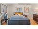 Serene bedroom with a double bed, hardwood floors, and artwork at 102 Circle Hill Rd, Sanford, FL 32773