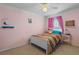 Cozy bedroom with a double bed and colorful bedding at 102 Circle Hill Rd, Sanford, FL 32773