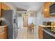 Eat-in kitchen with stainless steel appliances and wood cabinets at 102 Circle Hill Rd, Sanford, FL 32773