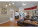 Open living room showcasing hardwood floors, comfortable seating, and kitchen access at 102 Circle Hill Rd, Sanford, FL 32773