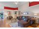 Spacious living area featuring hardwood floors, sectional sofa, and accent decor at 102 Circle Hill Rd, Sanford, FL 32773