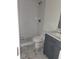Modern bathroom with gray vanity, hexagon tile shower, and marble-look flooring at 10232 Turkey Lake Rd # 181, Orlando, FL 32819