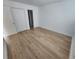 Light and bright bedroom featuring wood-look flooring at 10232 Turkey Lake Rd # 181, Orlando, FL 32819