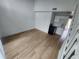 Modern kitchen with white cabinets, wood-look floors, and black appliances at 10232 Turkey Lake Rd # 181, Orlando, FL 32819