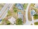 Overhead view showcasing the home's roof, backyard pool, and surrounding landscape at 103 Vega Ct, Davenport, FL 33896