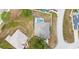 High-angle view of the house, highlighting its roofline and the surrounding yard with pool at 103 Vega Ct, Davenport, FL 33896