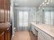 Clean bathroom with double vanity and a shower/tub combo at 103 Vega Ct, Davenport, FL 33896