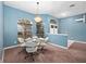 Dining area with glass table and four chairs at 103 Vega Ct, Davenport, FL 33896