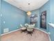 Dining area with glass table and four chairs at 103 Vega Ct, Davenport, FL 33896