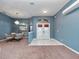 Entryway with double doors and a chandelier at 103 Vega Ct, Davenport, FL 33896