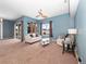 Comfortable Gathering room with backyard access and plenty of natural light at 103 Vega Ct, Davenport, FL 33896