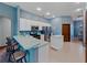 Eat-in kitchen with stainless steel appliances and breakfast bar at 103 Vega Ct, Davenport, FL 33896