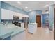 Kitchen with stainless steel appliances and an island at 103 Vega Ct, Davenport, FL 33896