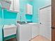 Laundry room with washer, dryer, and utility sink at 103 Vega Ct, Davenport, FL 33896