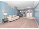 Open living room with dining area and access to the foyer at 103 Vega Ct, Davenport, FL 33896